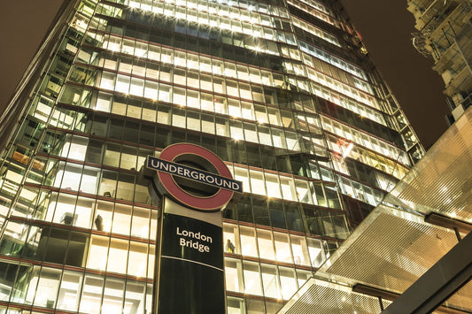The view of London Bridge London Underground station under The Shard at night.